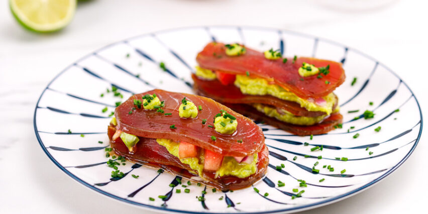 Layered tuna loin (mojama) with avocado and pico de gallo